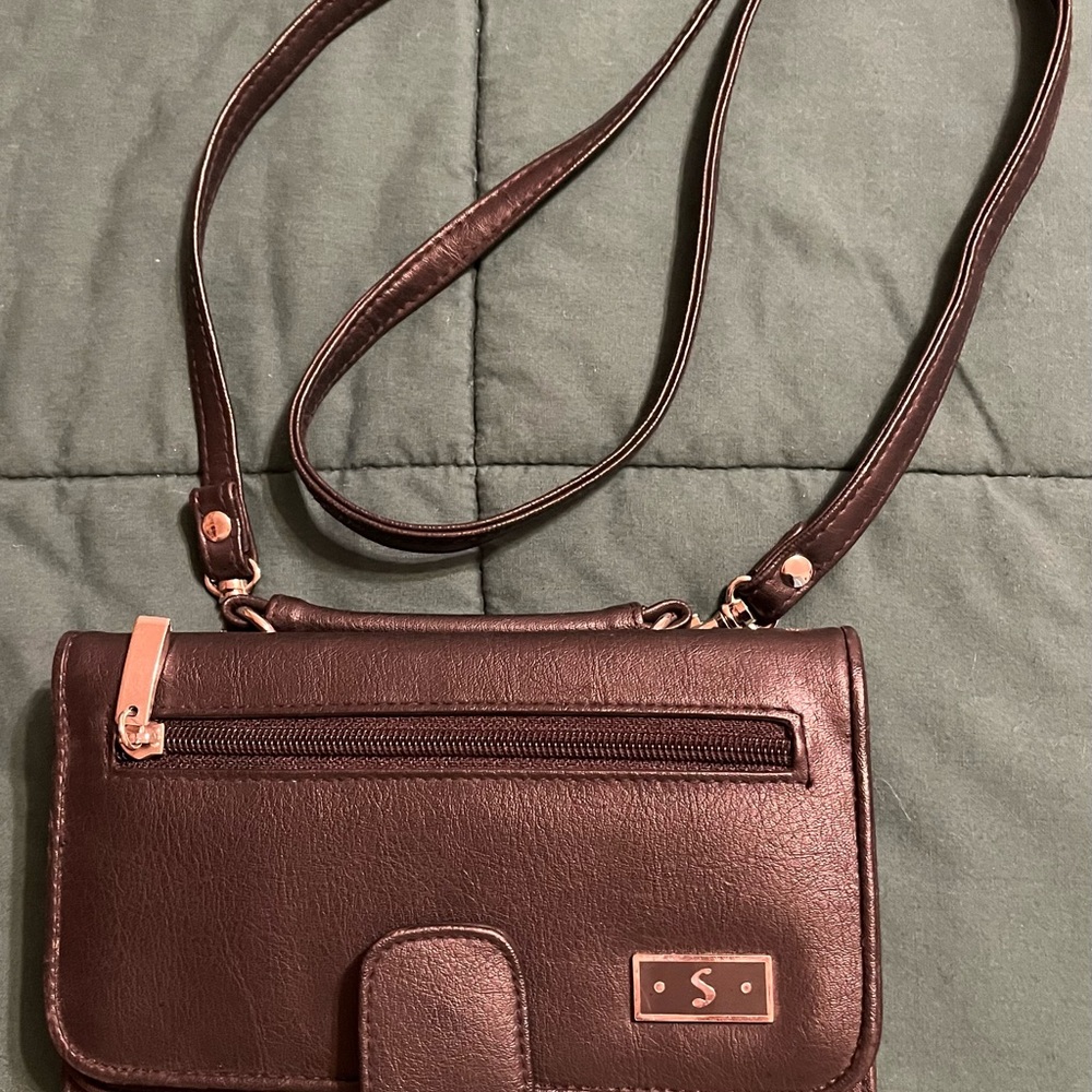 Black crossbody with tons of compartments also a mirror & carrying strap on top